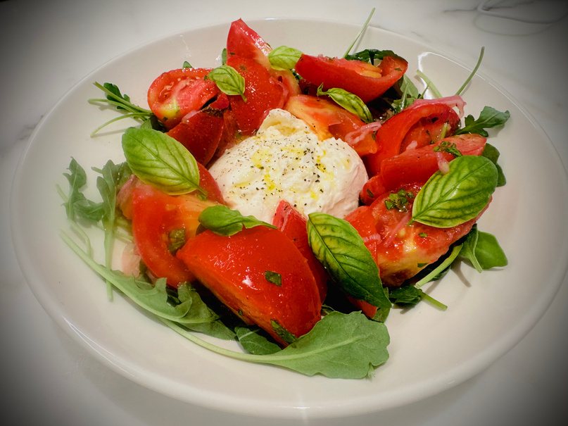 Burrata with heirloom tomatoes and basil
