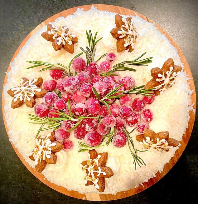 Holiday cake with sugared cranberries and gingerbread